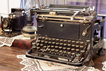 Vintage still life with old typewriter and camera