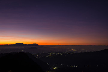 A colorful sunrise or sunset with a star on Bukit Penanjakan. Mount Bromo is an active volcano and one of the most visited tourist attractions in East Java, Indonesia.
