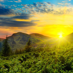 Beautiful mountain landscape at sunset the sun.