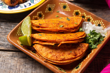 Mexican beef barbacoa tacos on wooden background