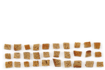 A scattering of crackers made from wheat bread