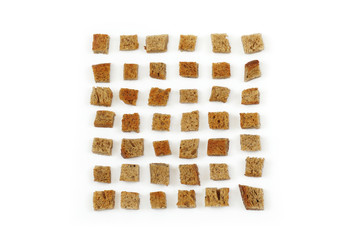 A scattering of crackers made from wheat bread