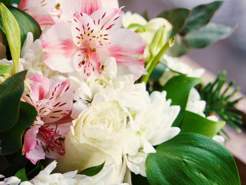 Macro photography of the bouquet of white chrysanthemums and pink alstroemeria. Floral pattern. Full of love flowers concepts. Beauty in nature. Suitable as background, greeting cards, template