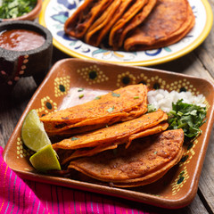 Mexican beef barbacoa tacos on wooden background