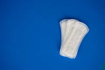 women's health and medicine - tampons on a blue background