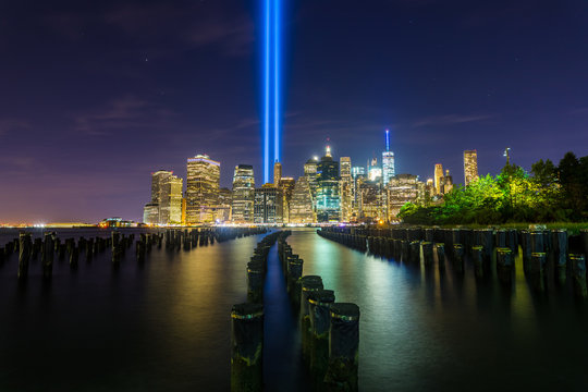 Looking out at Manhattan and two spotlights commemorating 9/11 from Brooklyn Bridge Park.