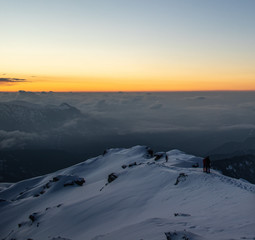 A beautiful view of a sunrise and himalayan mountains from the summit of a himalayan mountain
