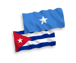National vector fabric wave flags of Somalia and Cuba isolated on white background. 1 to 2 proportion.