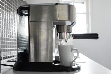 Close-up of making coffee in a coffee machine.