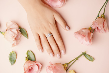 Ring on woman finger.