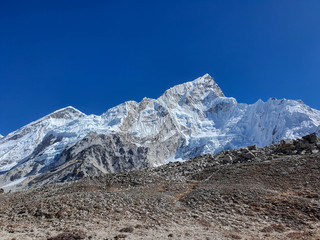 Trekkers on the way from Gorak Shep village to the legendary place - Everest base camp (EBC)....