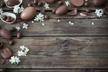 chocolate eggs on dark wooden background