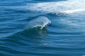 Naklejka premium Perfect wave breaking perfectly in Nazare Portugal