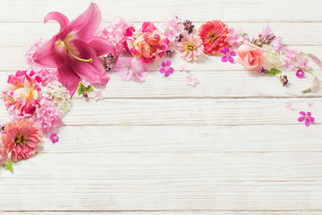pink flowers on white wooden background