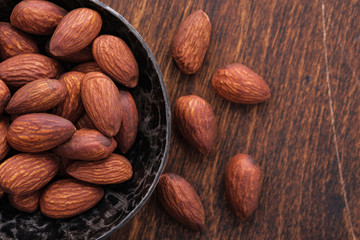 close-up nuts almonds on wooden table