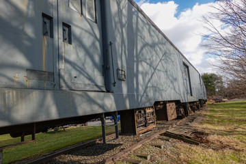 Fototapeta na wymiar Row of old rusted railroad train cars
