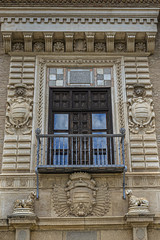View of Palacio de los Cordova (now Historical Archive). Palace of Cordova was built at Placeta de las Descalzas around 1530 - 1592. Palace surrounded by beautiful gardens. Granada, Andalusia, Spain.