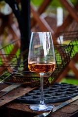 Barbecue party. One of the guests had left a glass of wine beside the brazier.