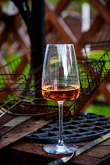 Barbecue party. One of the guests had left a glass of wine beside the brazier.