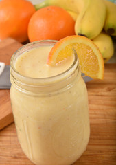 Obraz na płótnie Canvas Homemade orange banana smoothie