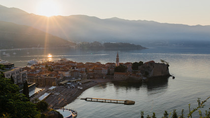 Naklejka premium The old city in Budva, Montenegro. Bay in the soft morning light of the sun.