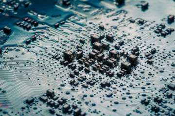 Circuit board. Electronic computer hardware technology. Motherboard digital chip. Tech science background. Integrated communication processor. SMD resistors and capacotors. Blue PCB.
