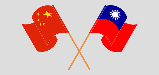 Crossed and waving flags of Taiwan and China