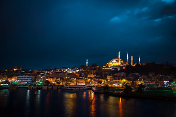 Suleymaniye Mosque view from Golden Horn during twilight with amazing lights and colors