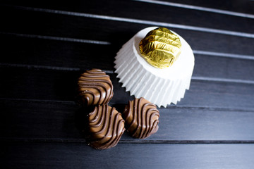 Various of sweet confectionery with chocolate candies and pralines. Handmade chocolates. Realistic chocolate set, delicious dessert pattern.