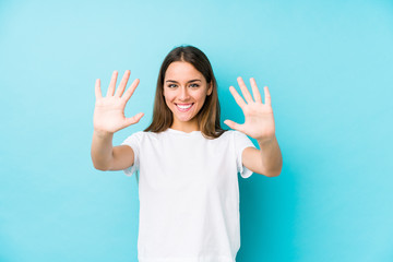 Young caucasian woman  isolated showing number ten with hands.