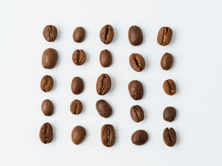 Roasted coffee beans isolated on white background.