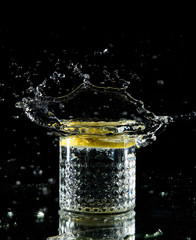 Water with a lemon in a glass