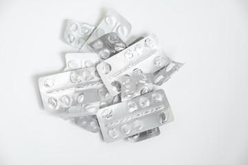 Used drugs, Used capsules, Used antibiotic packaging on white background, Close-up of empty package