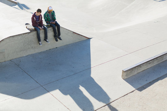 view from above of two teenage boys at skate-park