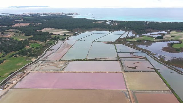 Salt evaporation ponds, salterns or salt works near the Colonia de Sant Jordi in Mallorca, view from drone