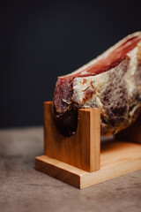 Iberian ham in a wooden ham stand