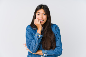 Young asian woman biting fingernails, nervous and very anxious.