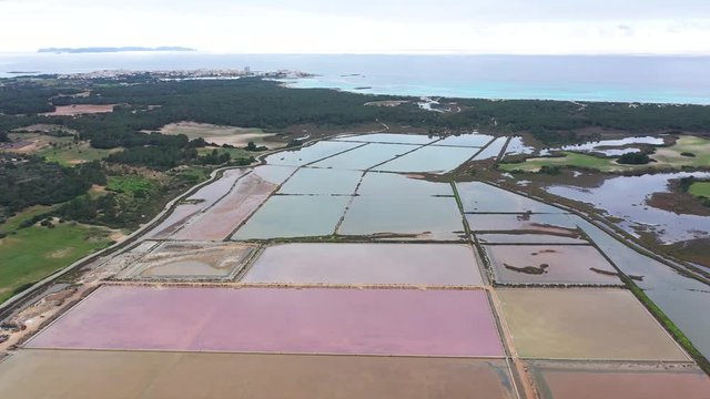 Salt evaporation ponds, salterns or salt works near the Colonia de Sant Jordi in Mallorca, view from drone