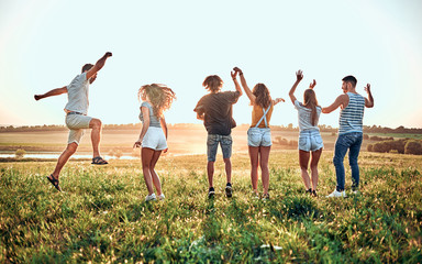 Group of friends having a party on nature