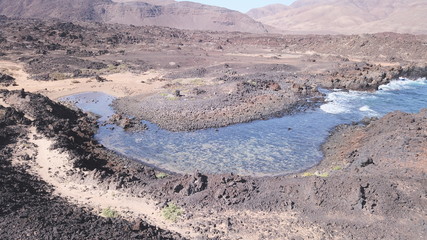 sunset between mountains cliffs and desert landscapes