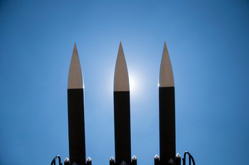 Rockets ready to be launched, defensive weapon system, against a bright blue sky. 