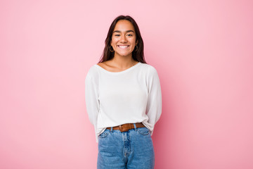 Young mixed race indian woman happy, smiling and cheerful.