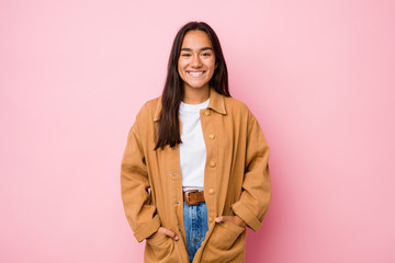 Young mixed race indian woman isolated happy, smiling and cheerful.