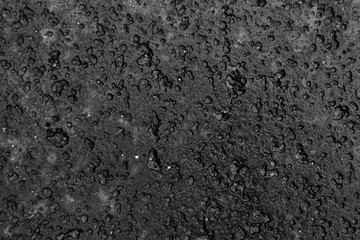 Black dented granite texture background