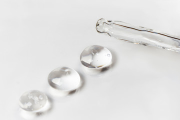 Drops of hyaluron on a white background medical concept Oxygen filled fluid