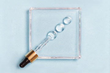 Drops of hyaluron on a blue background medical concept Oxygen filled fluid