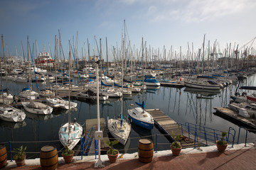 Cape Town, South Africa - October 25, 2017: Yachts docked at moorings at Royal Cape Yacht Club with blue sky in Cape Town South Africa.