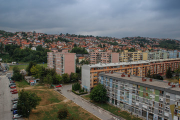 Fototapeta premium streets of the capital of Sarajevo, view of city buildings, cafes, restaurants and shops, people walk around the city. Sights of Sarajevo.