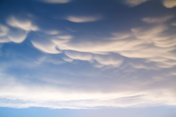 Beautiful clouds with blue sky background. Nature weather, mammatus cloud sky