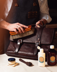 a man takes care of a leather product